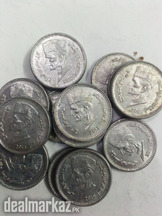 14 Pakistani coins of one rupee, issued in 2015,