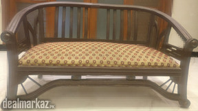 Two seater Kikkar wood sofa for sale.