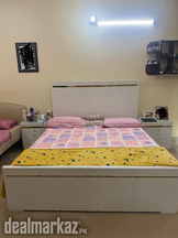 Double bed without mattress, side tables and dressing